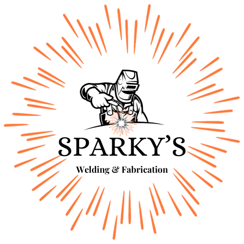 Welder in black with orange sparks logo.